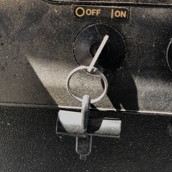 Image of Key Chain Valve In Head Key in the On position