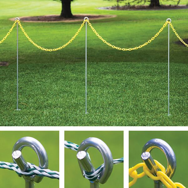 Deluxe steel combo rope & chain stake installed on turf